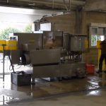 Laveuse de caisses grande cadence LCIGC avec ligne de convoyeurs